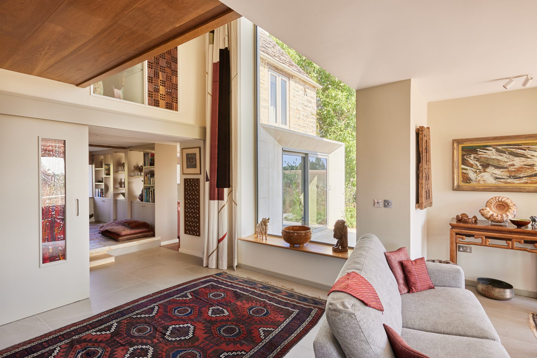 Inside the Cotswold extension — a double-height space with angled bay window
